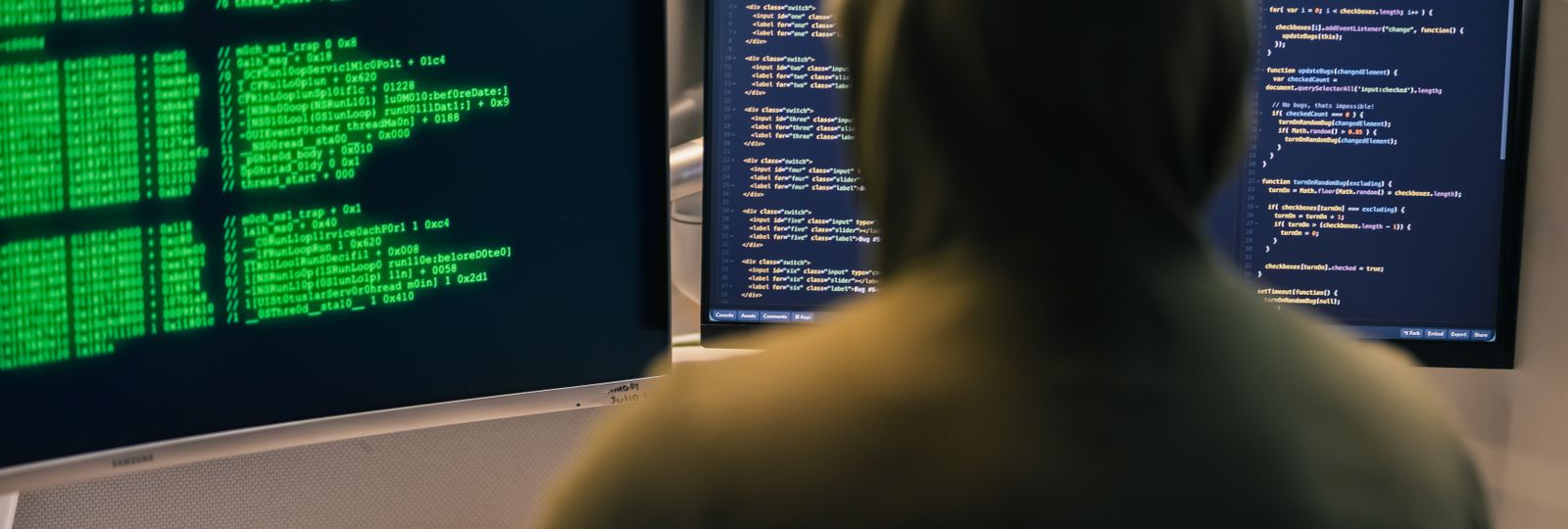 An operator working across code and terminal screens